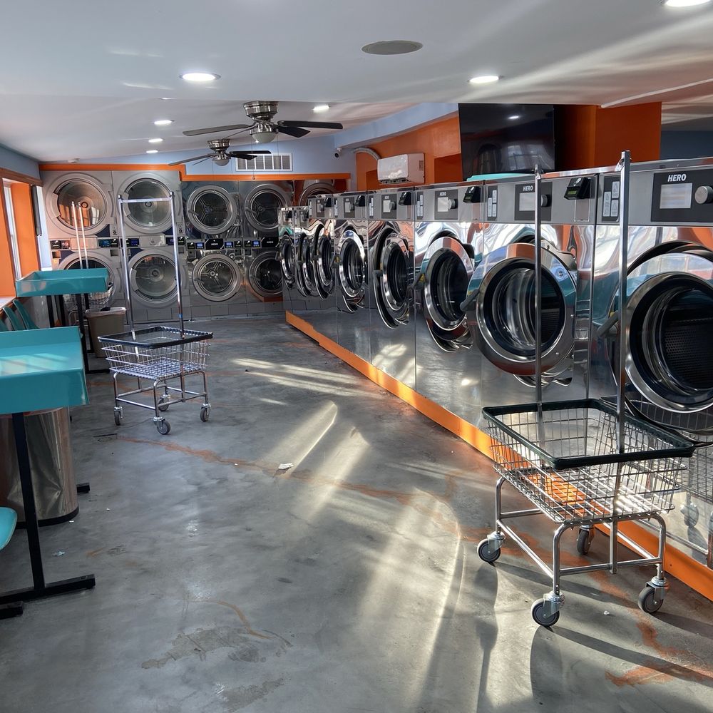 Modern laundromat with commercial washing machines supporting laundry pickup and delivery services in Frederick MD