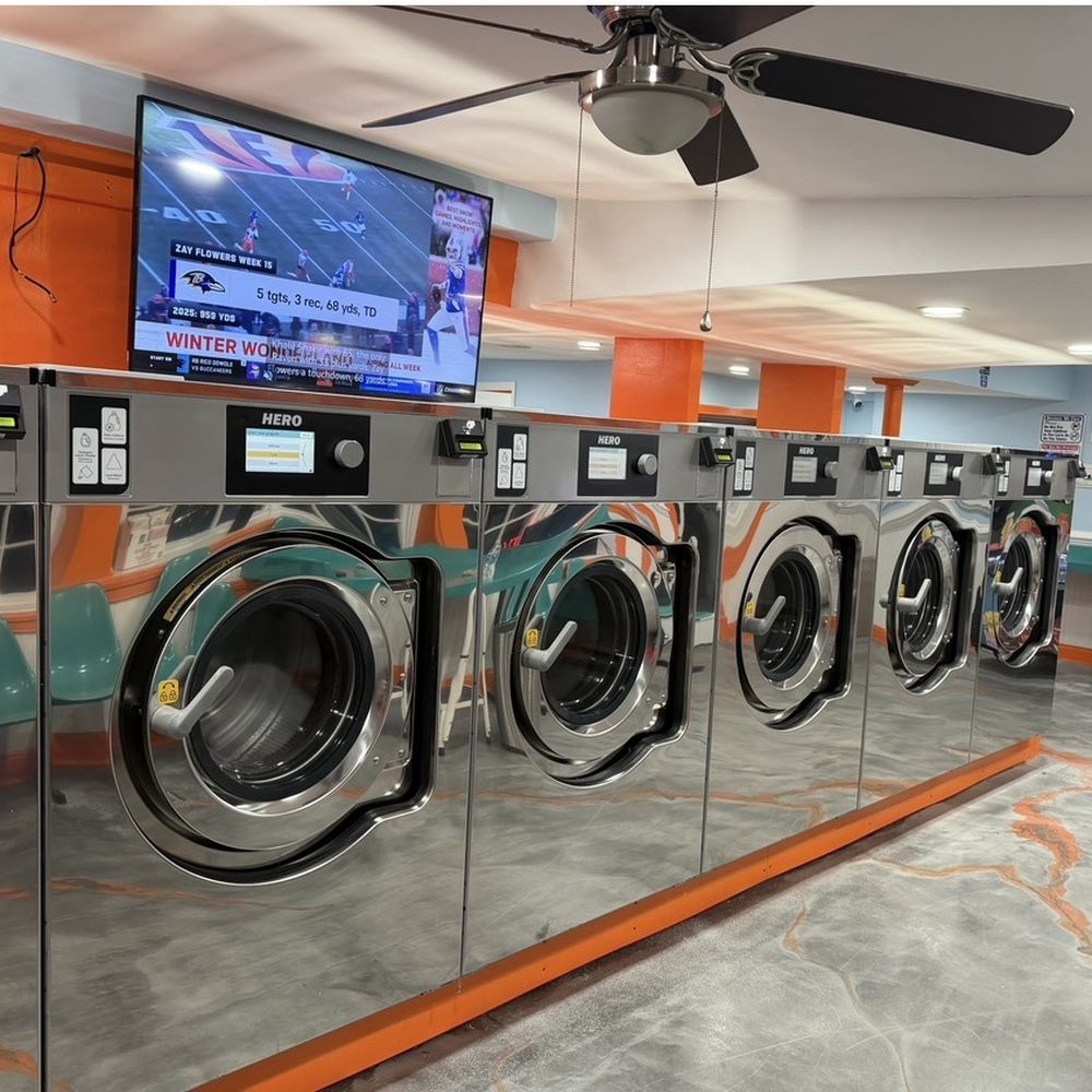 Professional laundry service in Urbana MD featuring clean, modern laundromat with washing machines for self-service and wash and fold laundry solutions