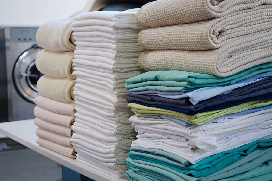 Professional wash and fold laundry service with neatly folded clean towels for customers in Ballenger Creek