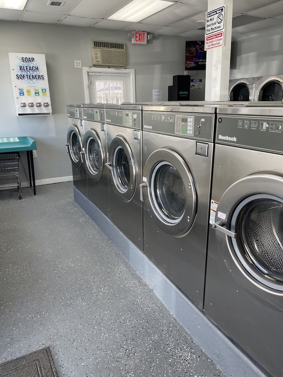 Commercial laundry room with multiple washing machines for vacation rental laundry service in Frederick MD