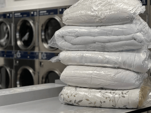 Freshly folded white towels for Airbnb laundry service in Frederick MD